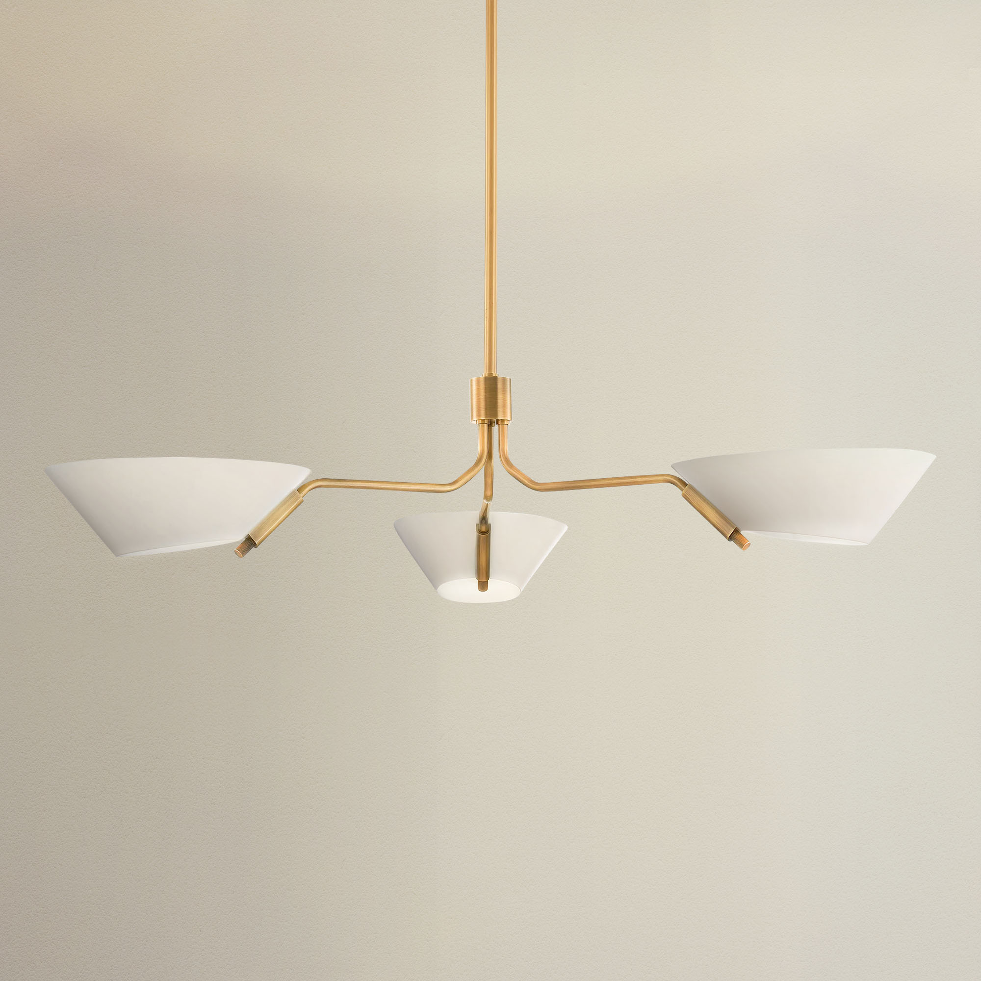 fractal gold pendant light with gold fixture and white shades, on