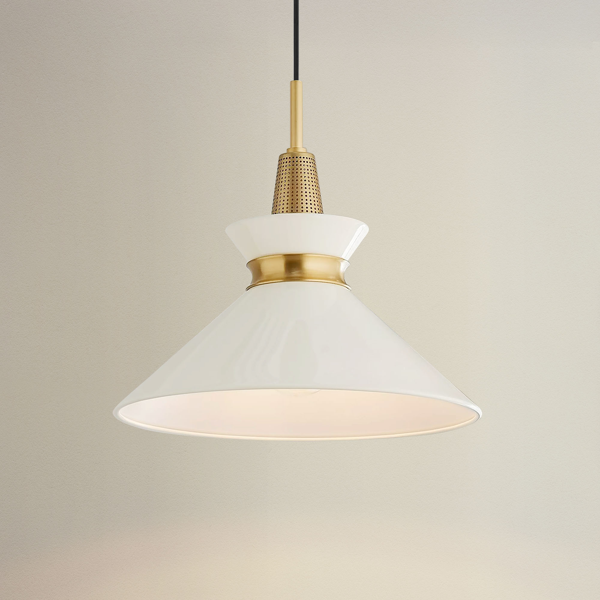 orbit bowl pendant light with white shade and gold fixture, on