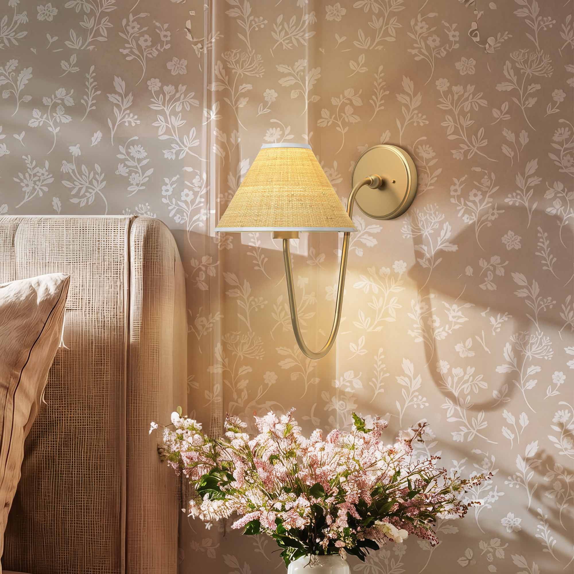 zoom soleil curve arm sconce for bedroom with floral arrangement against a patterned wall