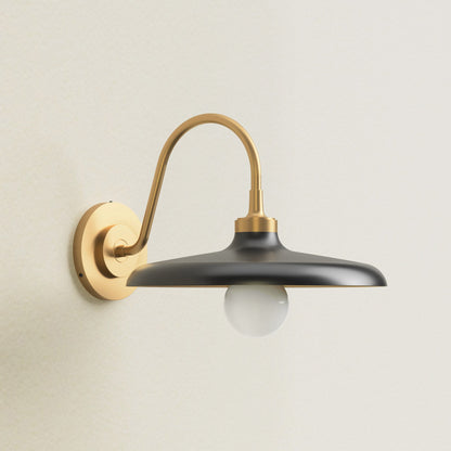 arcoris metal sconce light fixture with black shade and gold arm, off