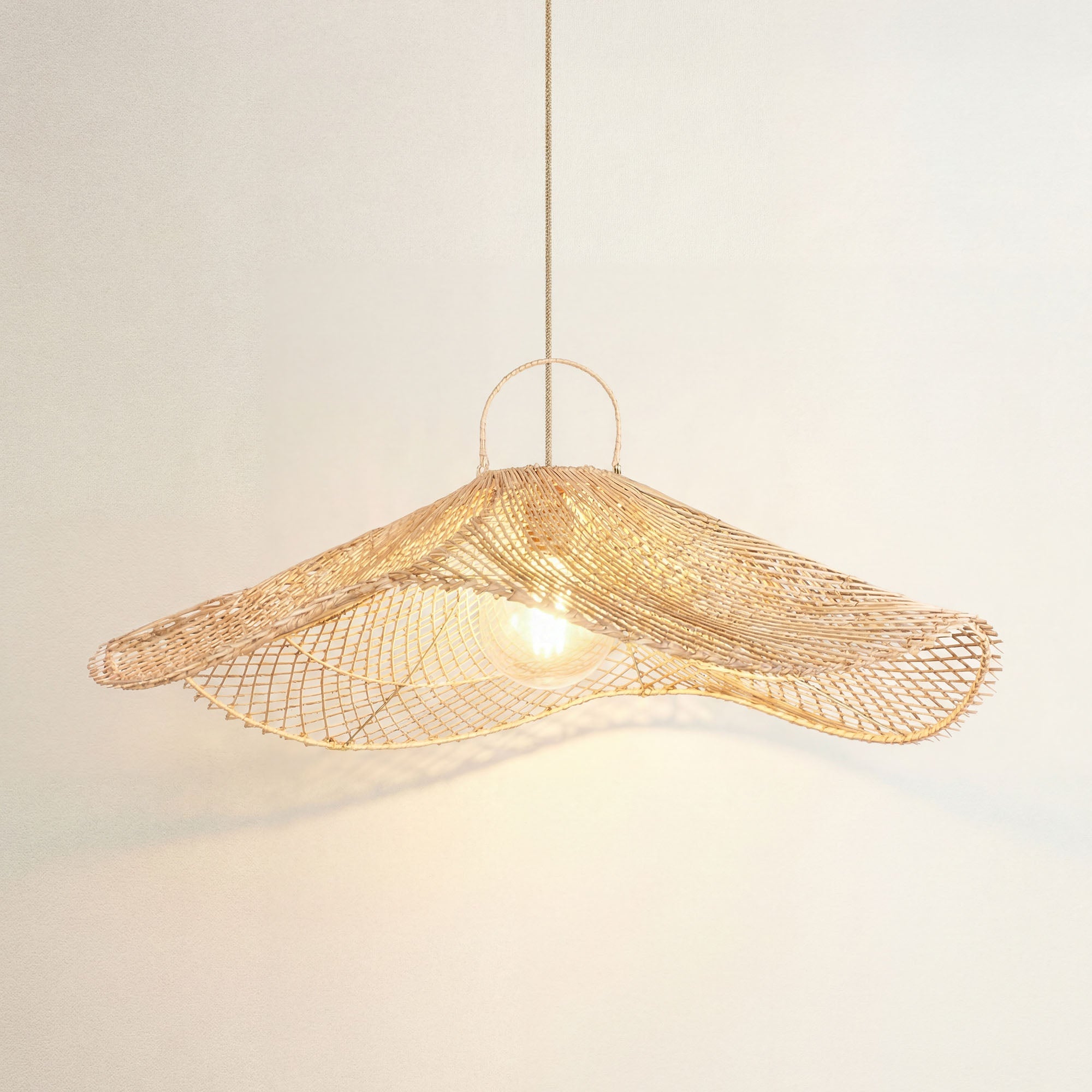 cover lotus woven rattan pendant light hanging against, on