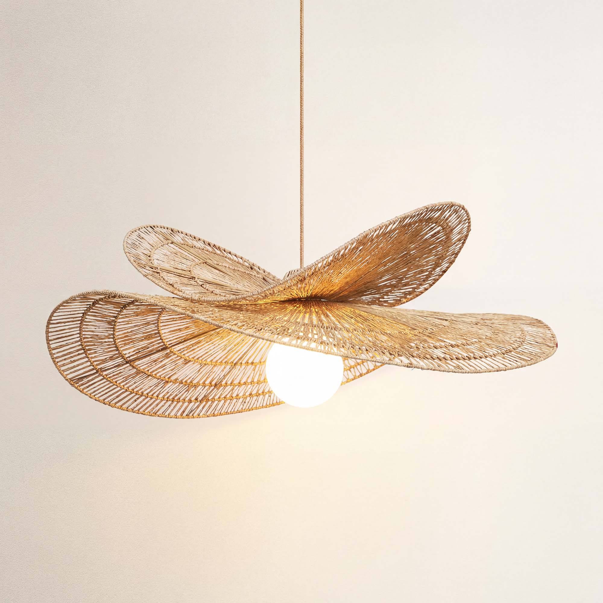 cover whisper leaf rattan pandent light with a wicker-like design, on
