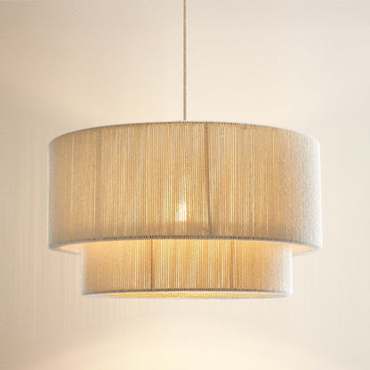 elaine beige rattan rendant light with a cylindrical shade, on