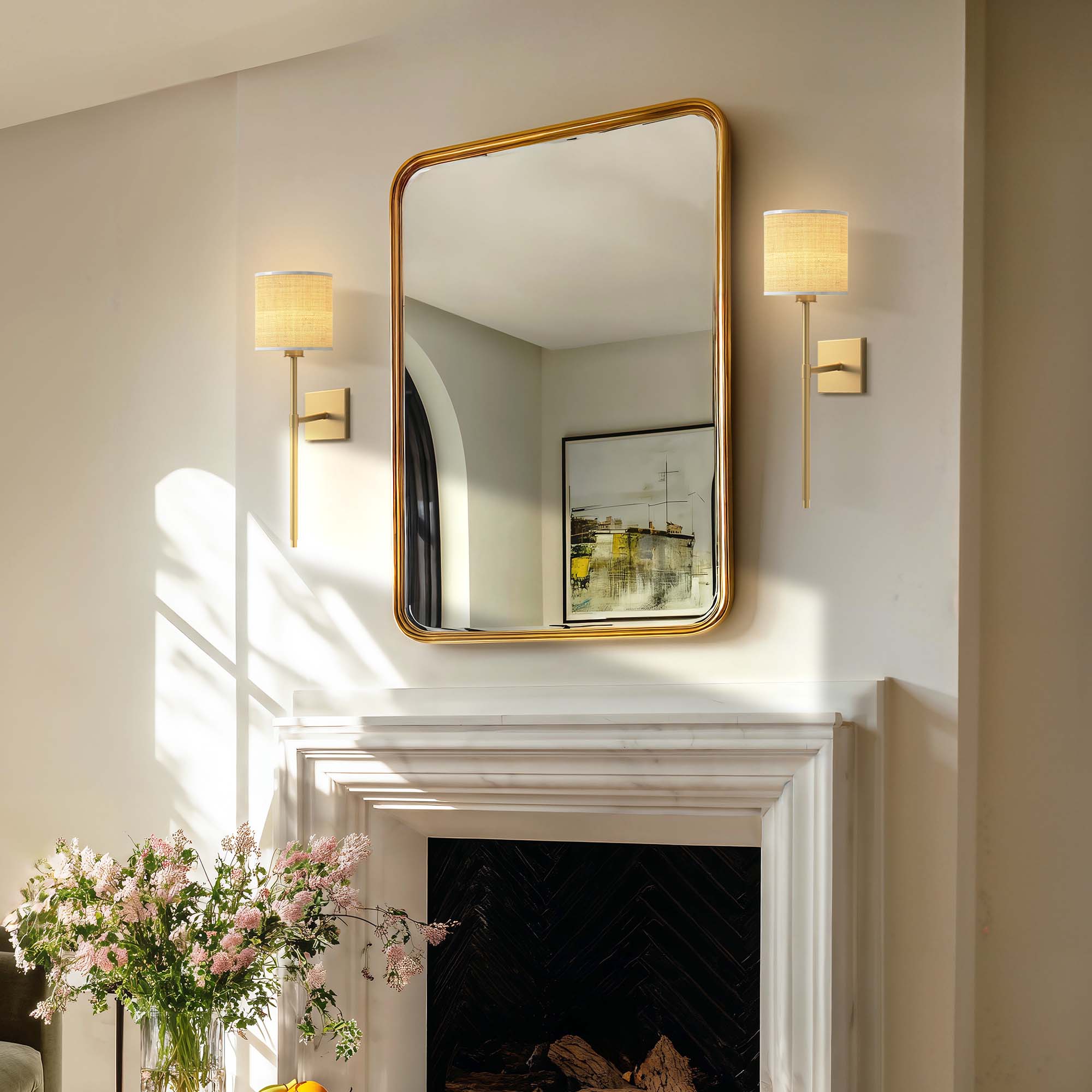luma rattan sconce for living room with gold-framed mirror with wall lights on either side