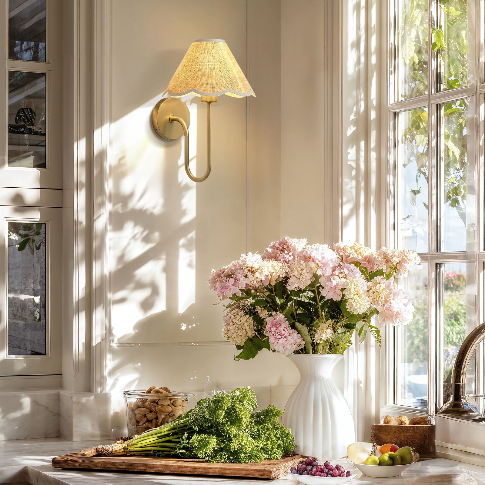 lyra rattan sconce for kitchen with a bouquet of pink flowers in a white vase on a countertop
