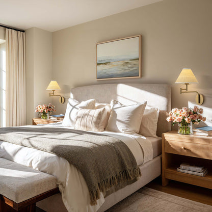 naia rattan sconce for bedroom with a neatly made bed and a painting on the wall