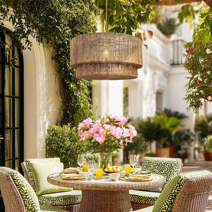 outdoor luminous pendant light in a dining patio setting with wicker furniture