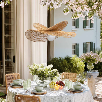 outdoor whisper leaf pendant light for dining table setting with flowers, fruit, and a decorative ceiling light