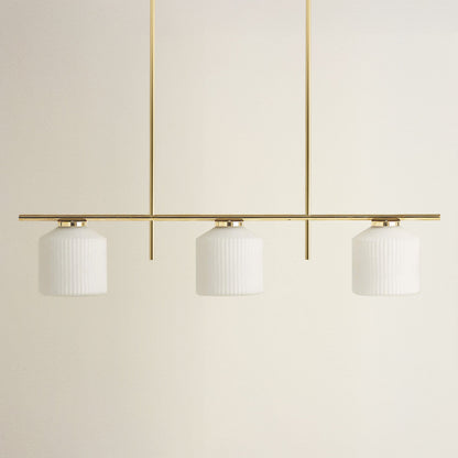 serene polished 3 light pendant light with three white glass shades and gold metal frame, off