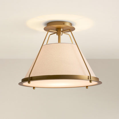 solace flush mount ceiling light fixture with gold frame and white shade, on