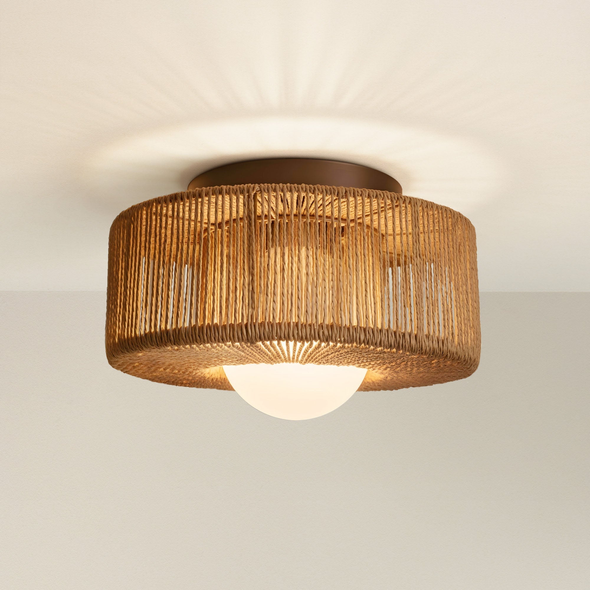 vela flush mount ceiling light fixture with woven design, on